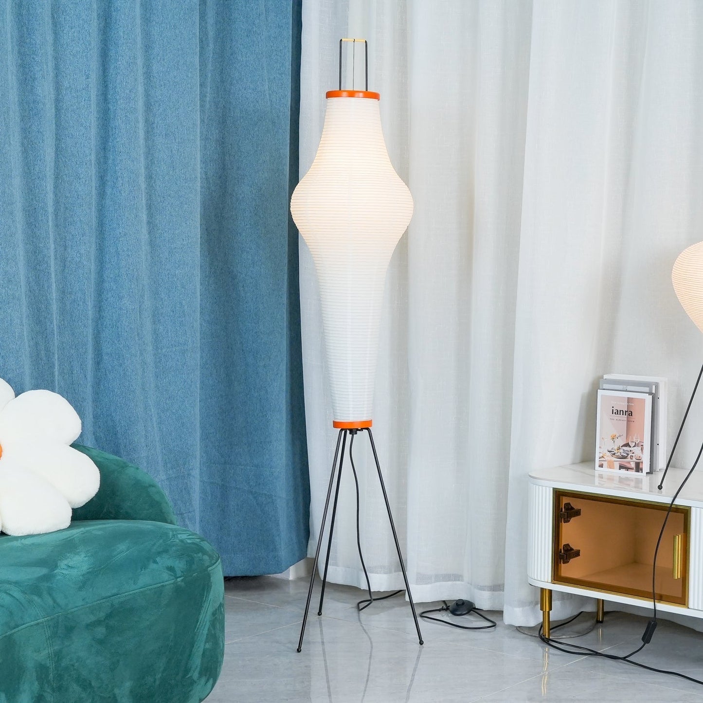 "Minimalist rice paper floor lamp with sleek metal frame and soft diffused light, perfect for creating a warm ambiance."