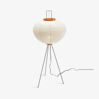 "Minimalist rice paper floor lamp with sleek metal frame and soft diffused light, perfect for creating a warm ambiance."
