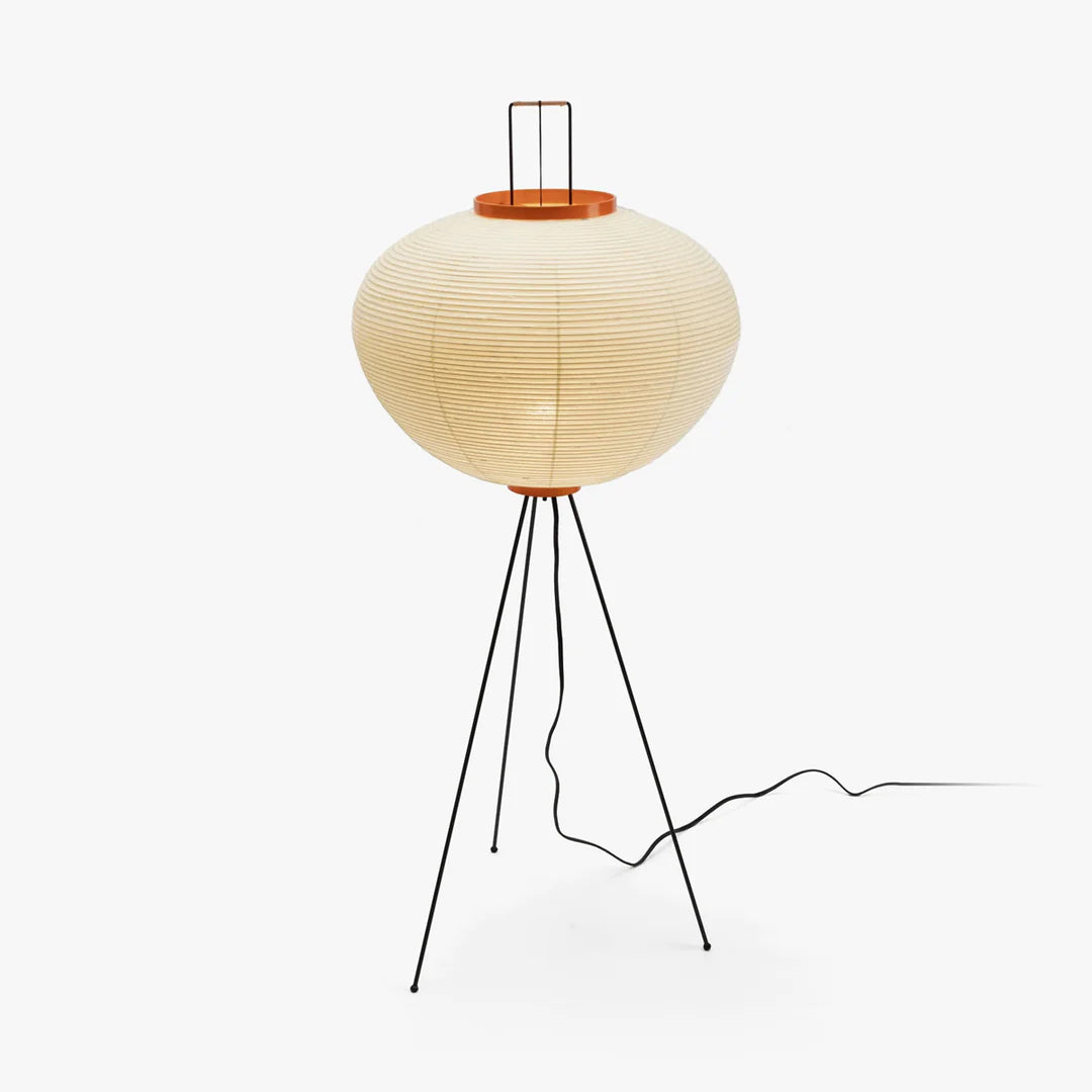 "Minimalist rice paper floor lamp with sleek metal frame and soft diffused light, perfect for creating a warm ambiance."