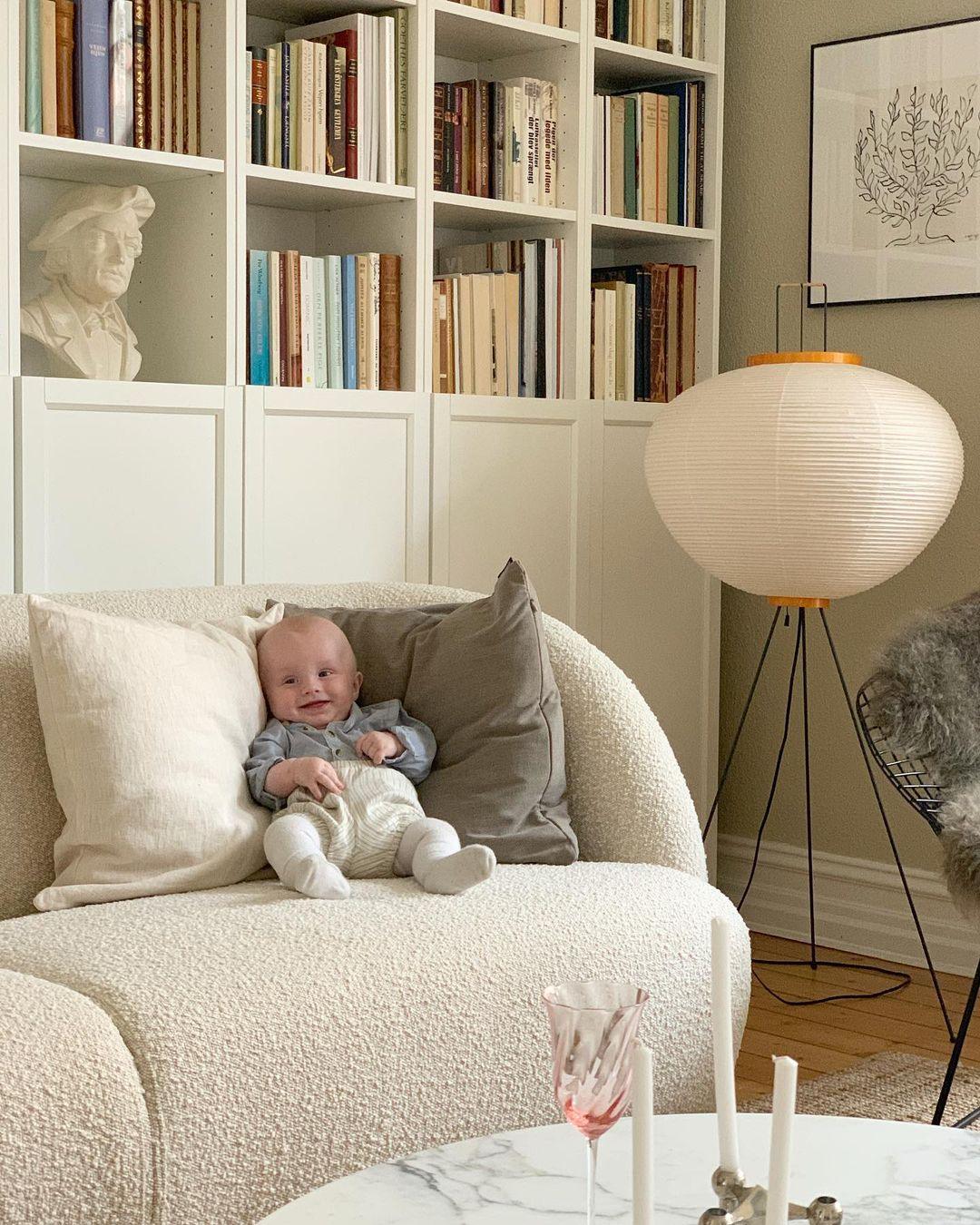 "Minimalist rice paper floor lamp with sleek metal frame and soft diffused light, perfect for creating a warm ambiance."