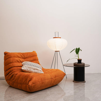"Minimalist rice paper floor lamp with sleek metal frame and soft diffused light, perfect for creating a warm ambiance."