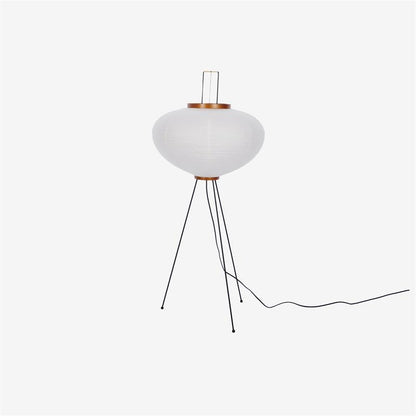 "Minimalist rice paper floor lamp with sleek metal frame and soft diffused light, perfect for creating a warm ambiance."