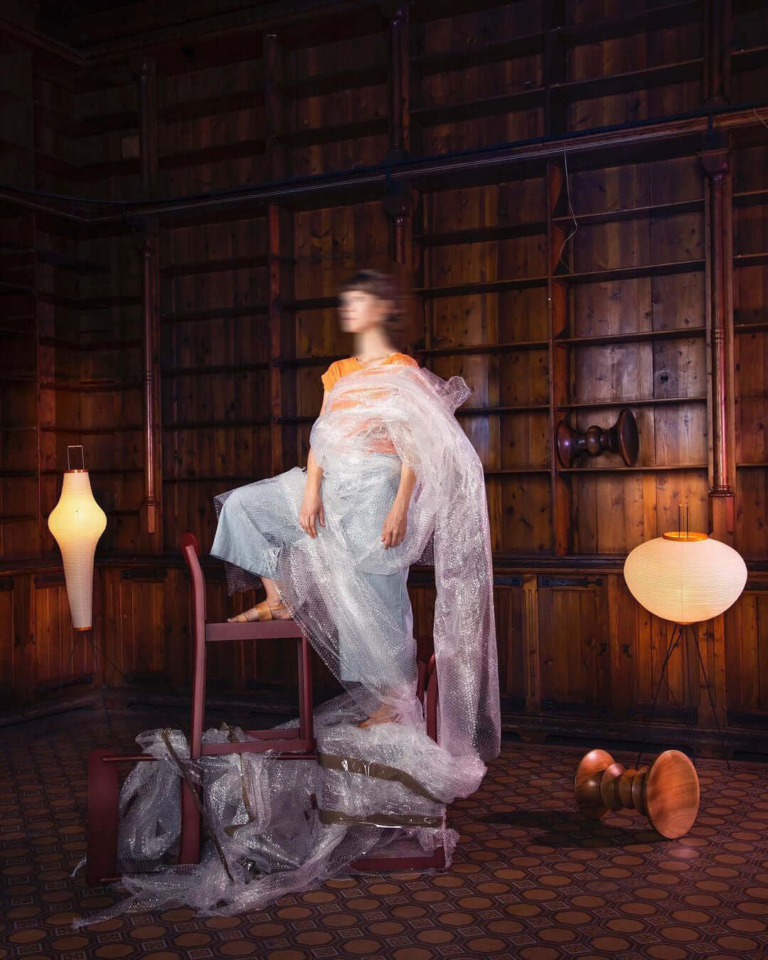 "Minimalist rice paper floor lamp with sleek metal frame and soft diffused light, perfect for creating a warm ambiance."