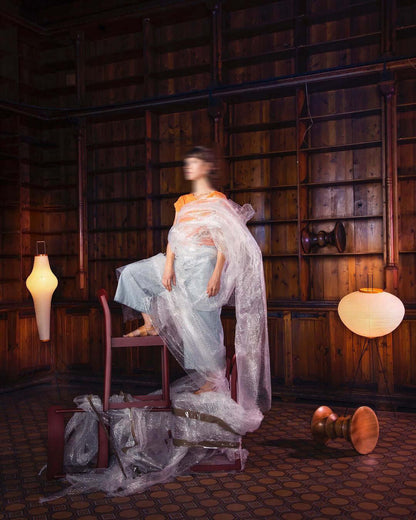 "Minimalist rice paper floor lamp with sleek metal frame and soft diffused light, perfect for creating a warm ambiance."