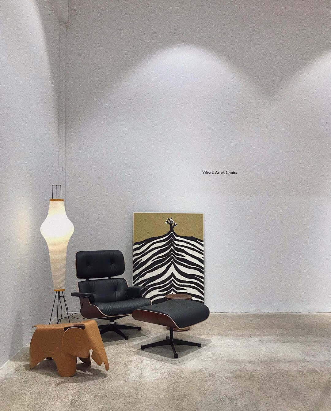 "Minimalist rice paper floor lamp with sleek metal frame and soft diffused light, perfect for creating a warm ambiance."