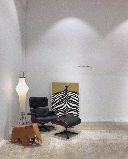 "Minimalist rice paper floor lamp with sleek metal frame and soft diffused light, perfect for creating a warm ambiance."