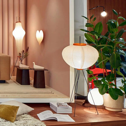 "Minimalist rice paper floor lamp with sleek metal frame and soft diffused light, perfect for creating a warm ambiance."
