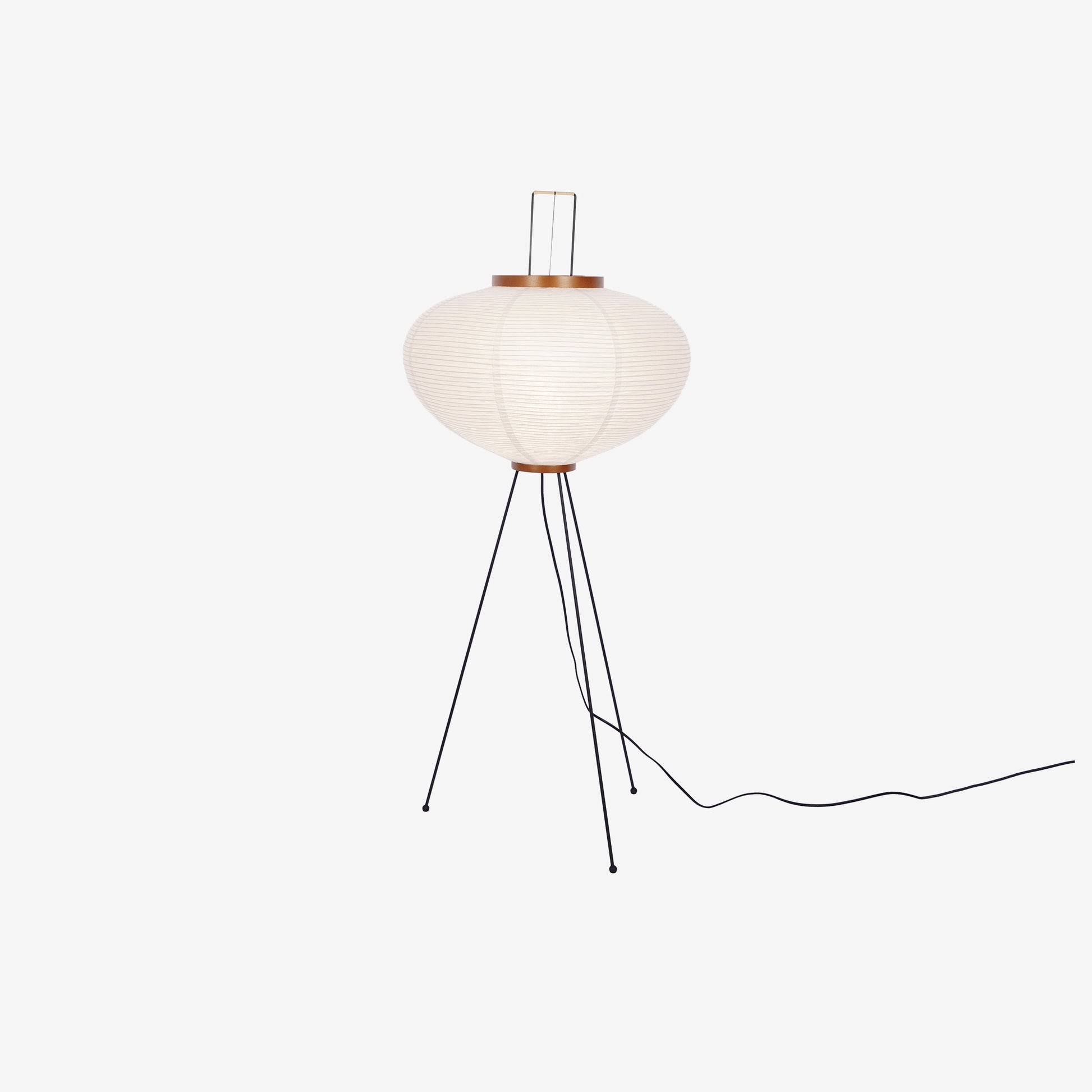 "Minimalist rice paper floor lamp with sleek metal frame and soft diffused light, perfect for creating a warm ambiance."