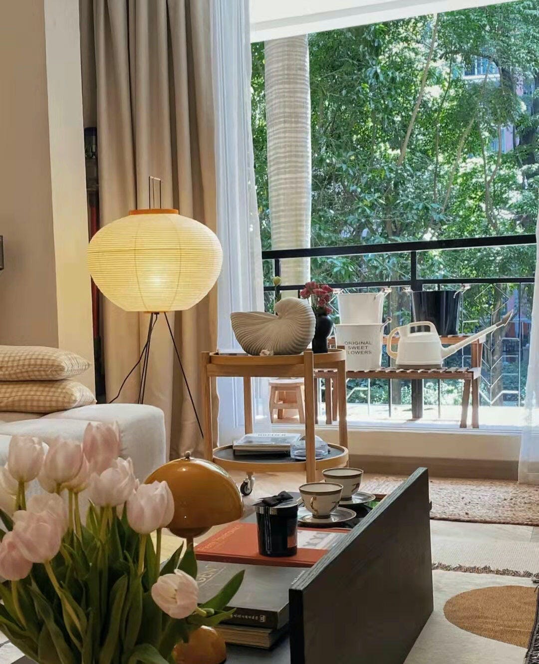 "Minimalist rice paper floor lamp with sleek metal frame and soft diffused light, perfect for creating a warm ambiance."