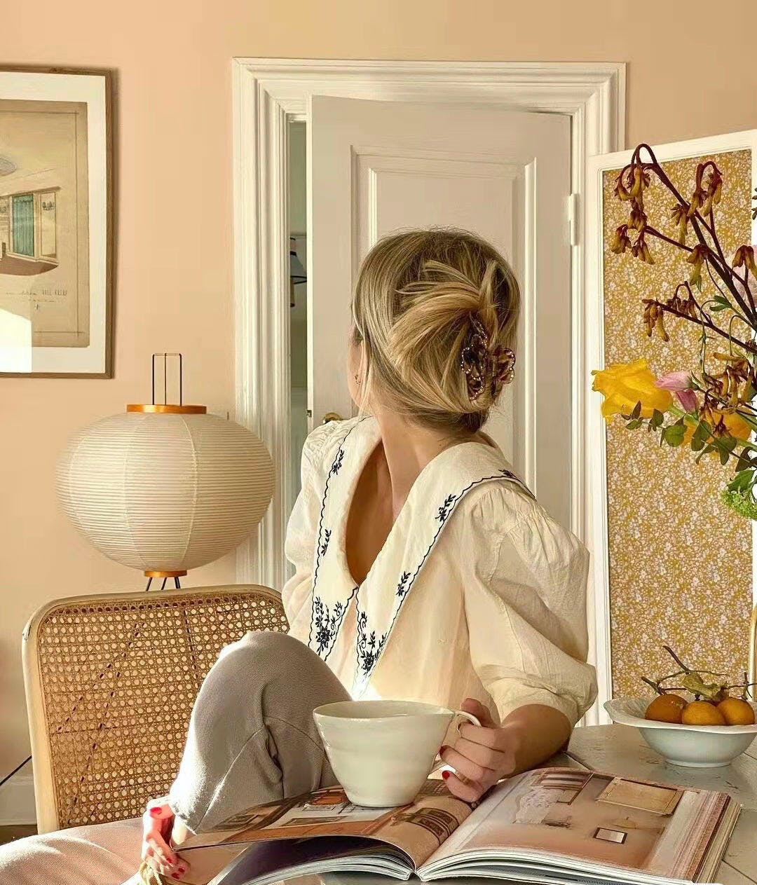 "Minimalist rice paper floor lamp with sleek metal frame and soft diffused light, perfect for creating a warm ambiance."