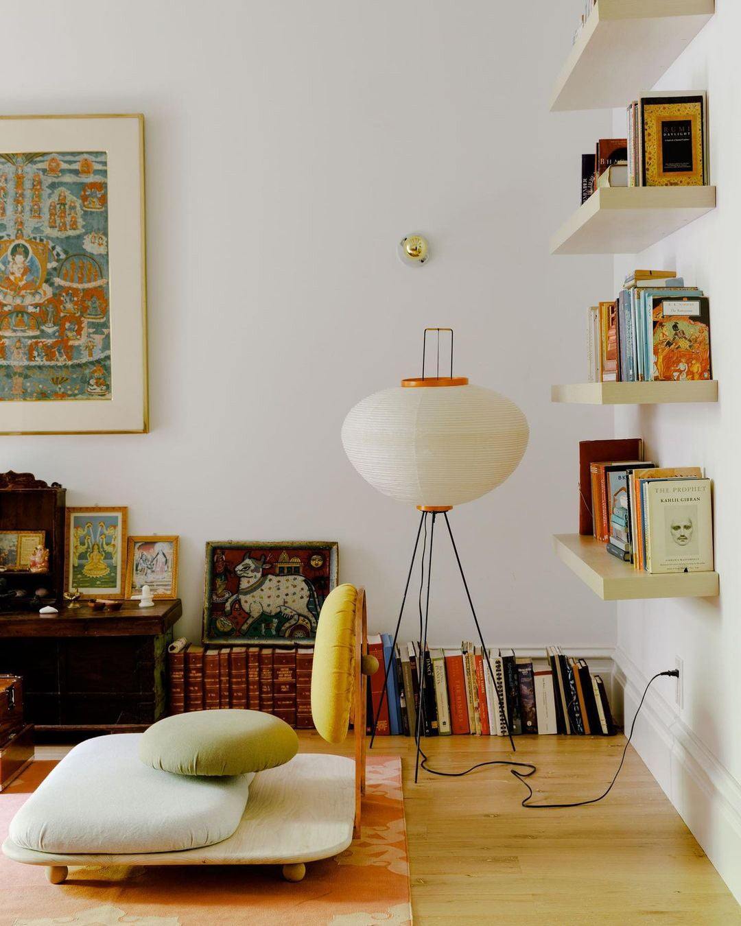 "Minimalist rice paper floor lamp with sleek metal frame and soft diffused light, perfect for creating a warm ambiance."