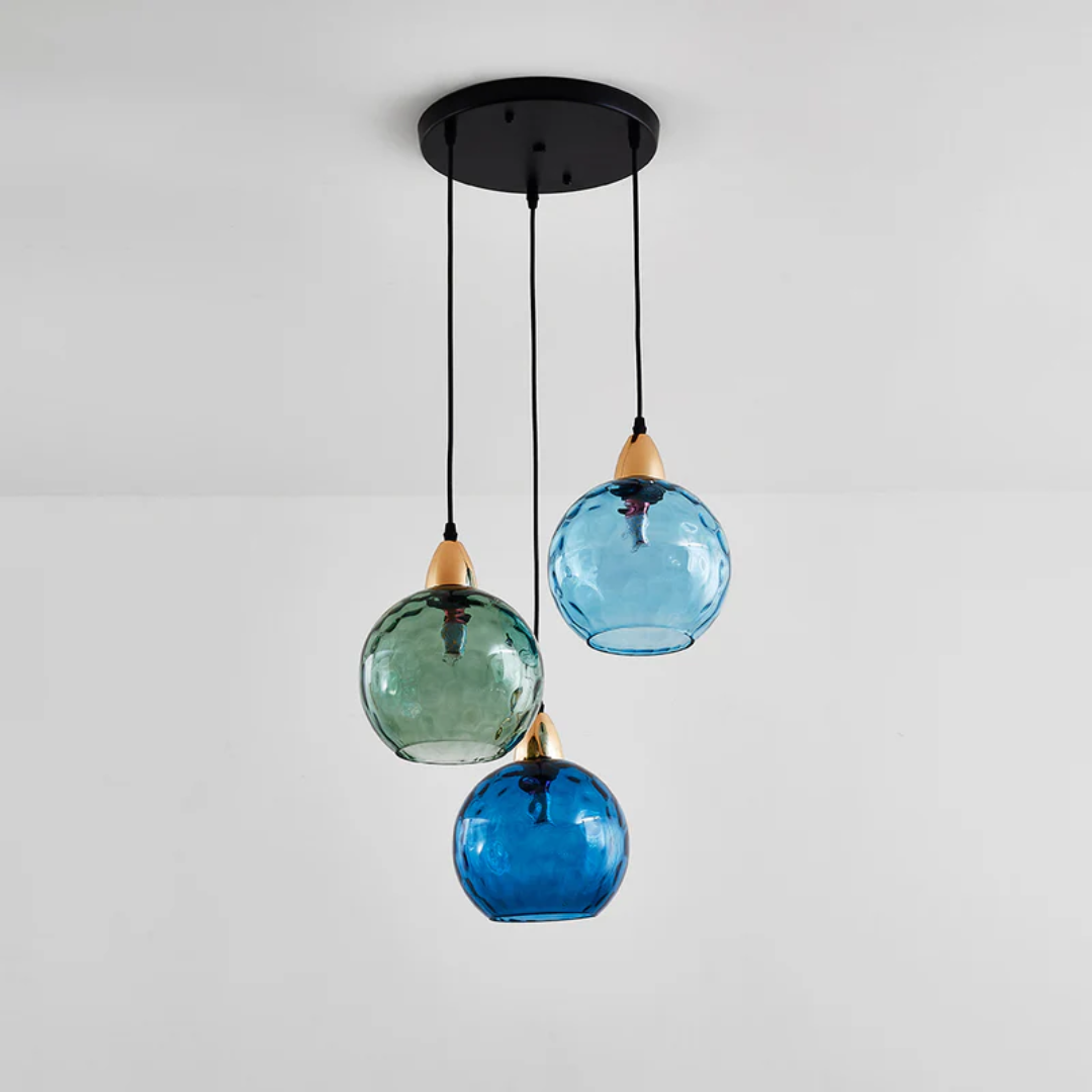 Stylish cascade pendant light with three lamps, perfect for dining rooms.