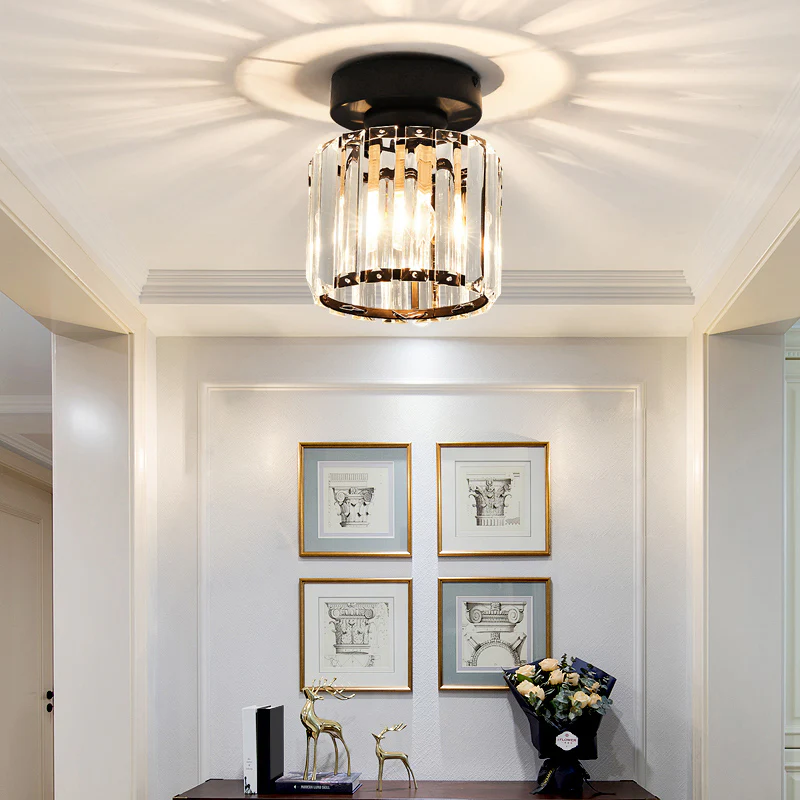 Modern black crystal flush mount ceiling light, sleek brass fixture, crystal shade, ideal for rooms with low ceilings.