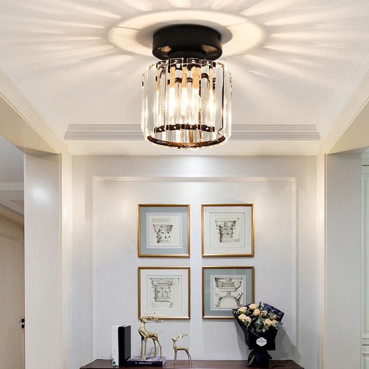 Modern black crystal flush mount ceiling light, sleek brass fixture, crystal shade, ideal for rooms with low ceilings.