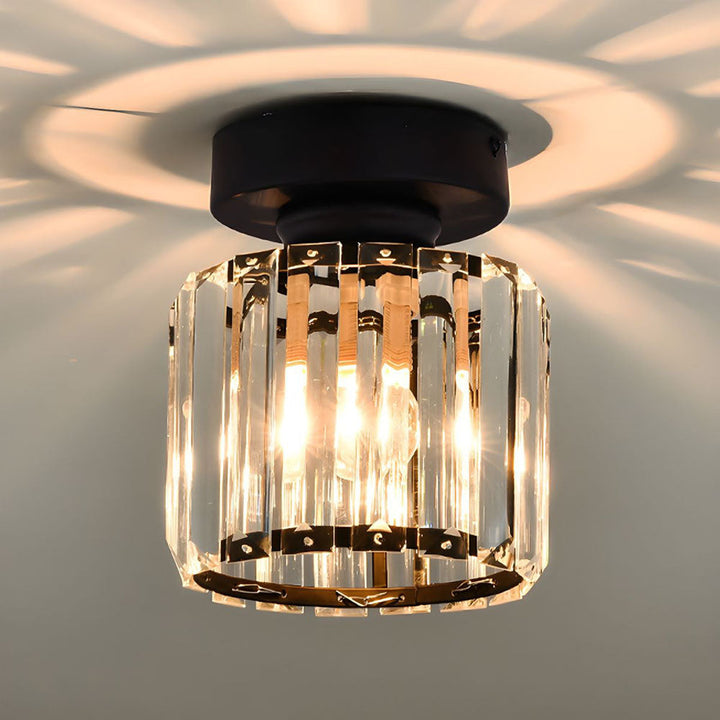 Modern black crystal flush mount ceiling light, sleek brass fixture, crystal shade, ideal for rooms with low ceilings.