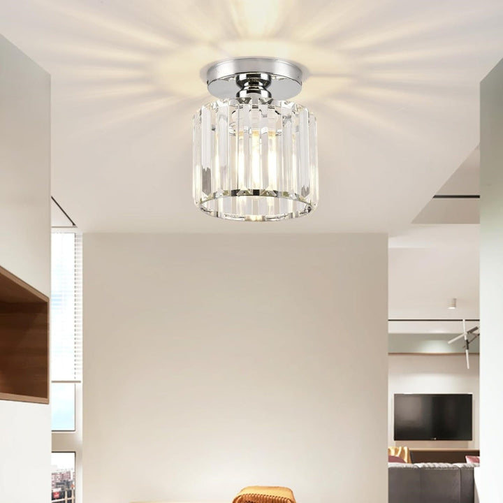 Modern black crystal flush mount ceiling light, sleek brass fixture, crystal shade, ideal for rooms with low ceilings.