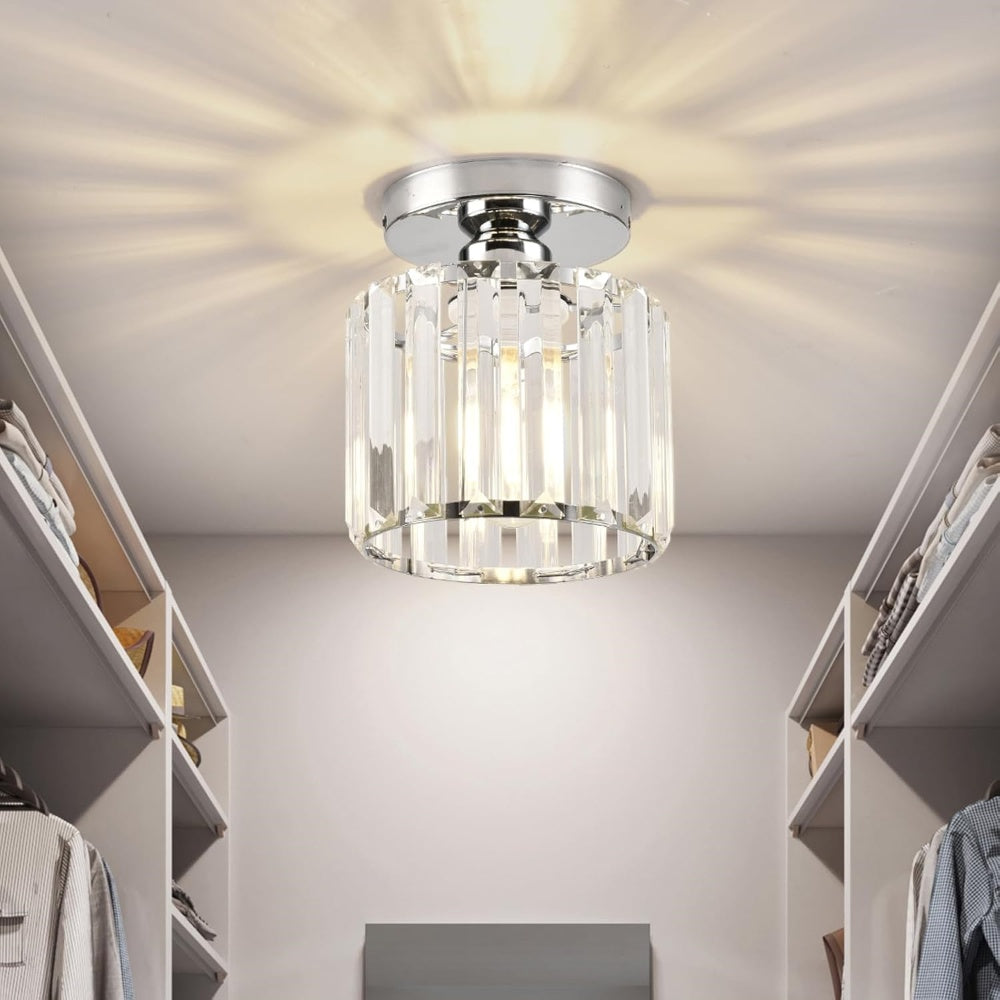 Modern black crystal flush mount ceiling light, sleek brass fixture, crystal shade, ideal for rooms with low ceilings.