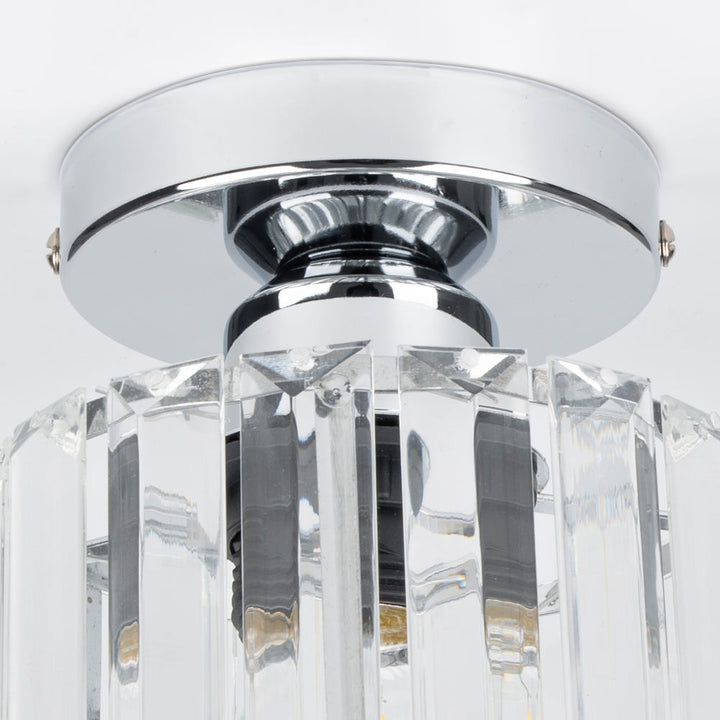Modern black crystal flush mount ceiling light, sleek brass fixture, crystal shade, ideal for rooms with low ceilings.