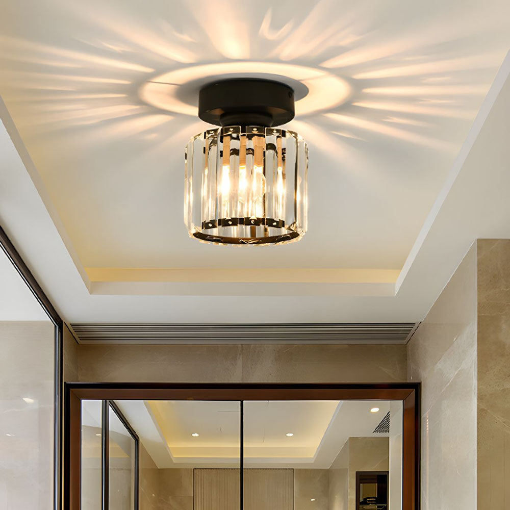 Modern black crystal flush mount ceiling light, sleek brass fixture, crystal shade, ideal for rooms with low ceilings.