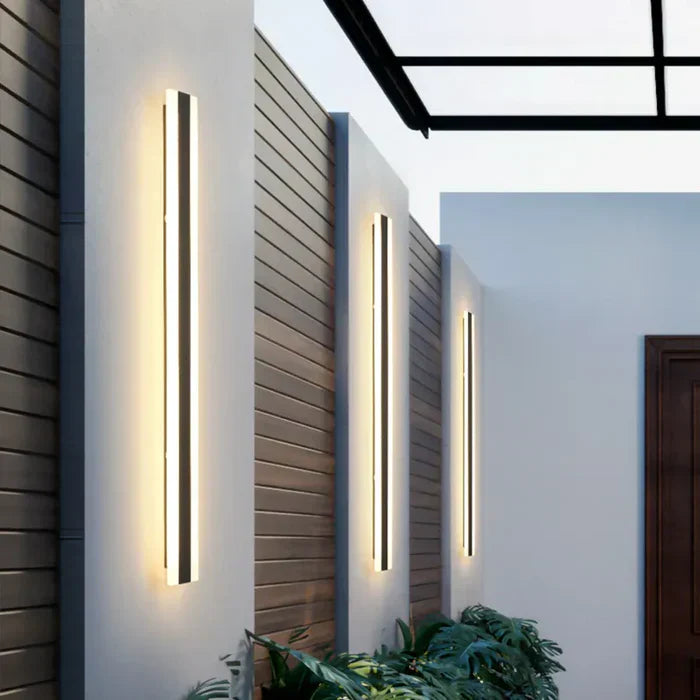 Sleek black LED wall lamp for outdoor use, modern exterior lighting with weather-resistant design, perfect for home accents.