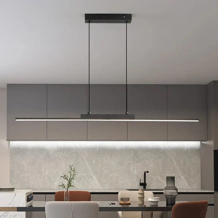 "Modern black pendant light with tubular silhouette, minimalist aluminium fixture, perfect for dining rooms and kitchens."