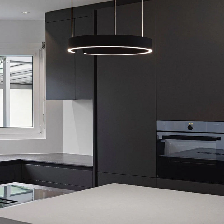 Contemporary circular LED pendant light, HaloRing, illuminating dining areas with modern, energy-efficient glow.