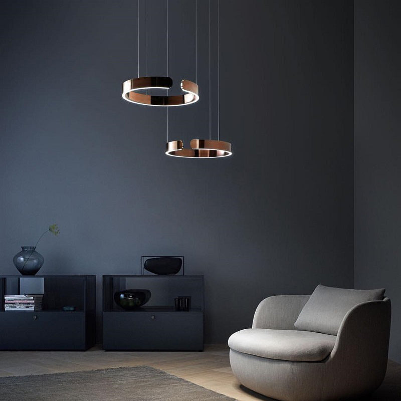 "Modern circular LED pendant light in minimal design, black finish, ideal for elegant home interiors and efficient lighting."