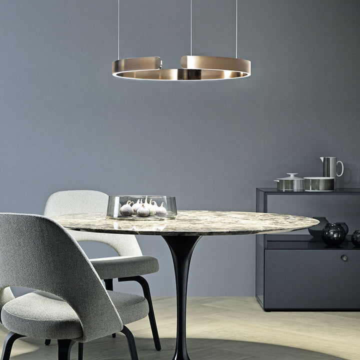 "Modern circular LED pendant light in minimal design, black finish, ideal for elegant home interiors and efficient lighting."