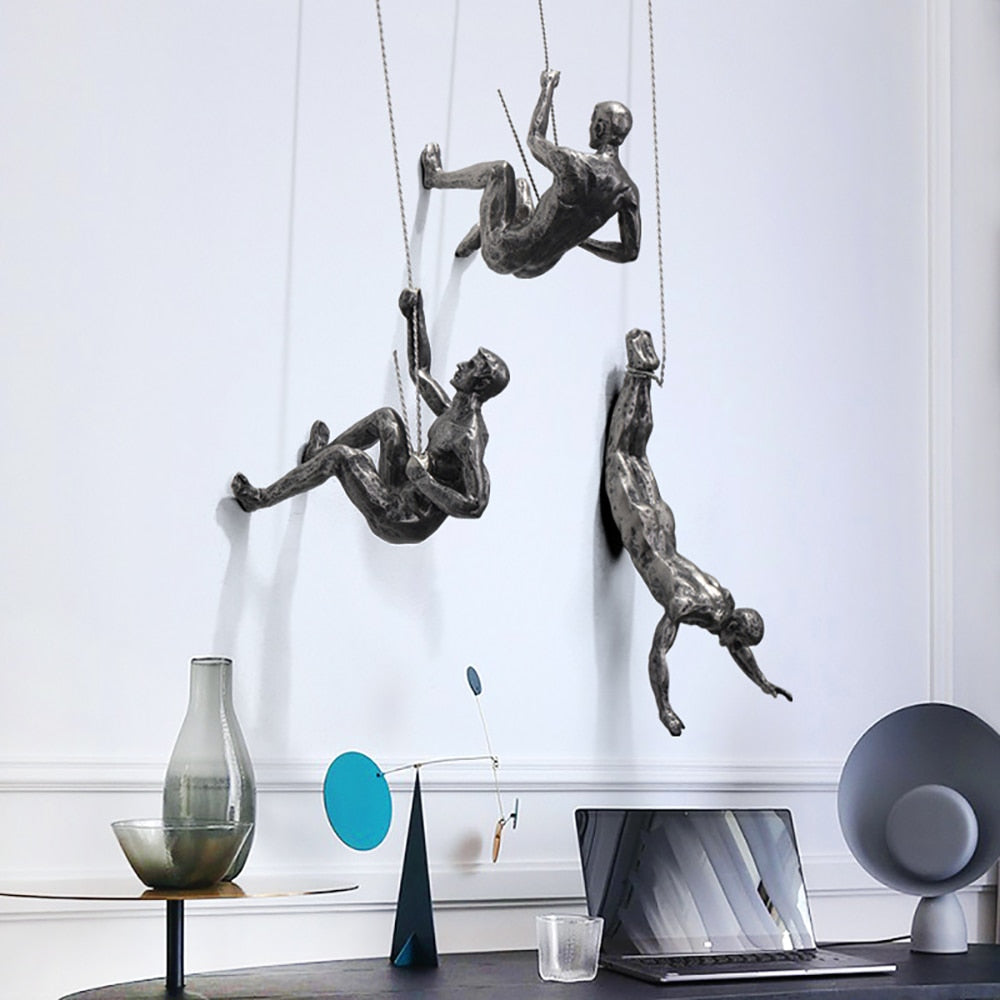 Decorative climber figure wall sculpture. Modern artistic decor for stylish homes & professional offices.