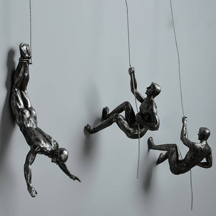 Sleek climber wall sculpture, a modern art piece enhancing any contemporary home or office space.
