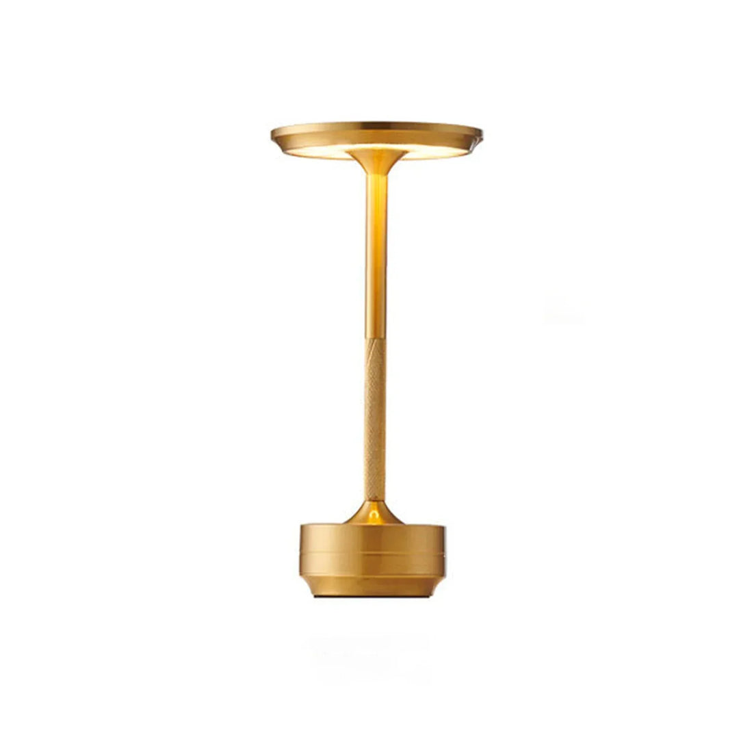 Modern cordless table lamp with touch control, Nordic design, gold frame, brushed finish, illuminating a stylish room.