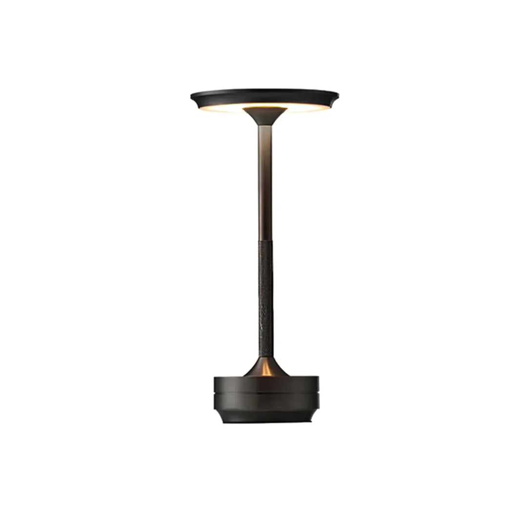 Modern cordless table lamp with touch control, Nordic design, gold frame, brushed finish, illuminating a stylish room.