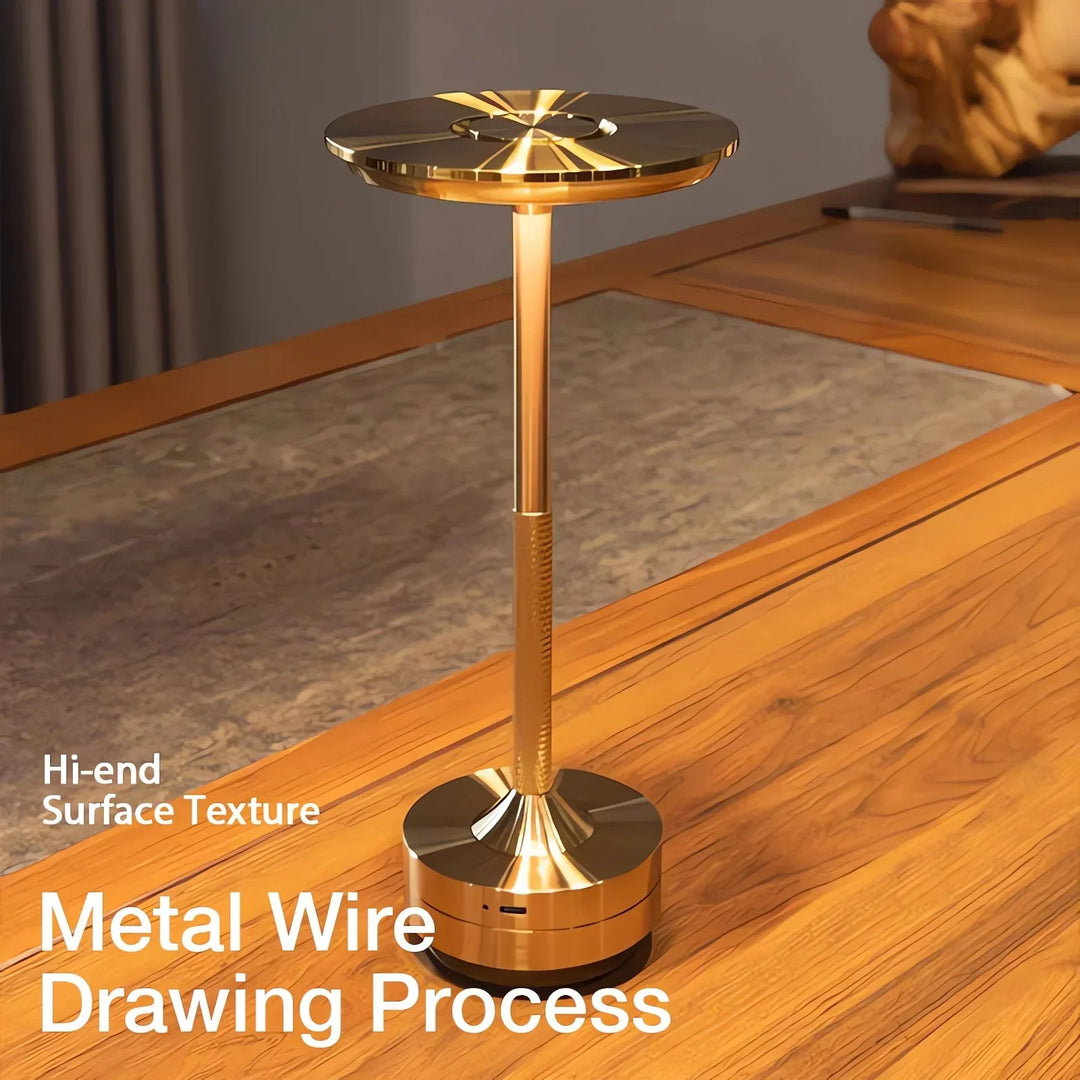 Modern cordless table lamp with touch control, Nordic design, gold frame, brushed finish, illuminating a stylish room.