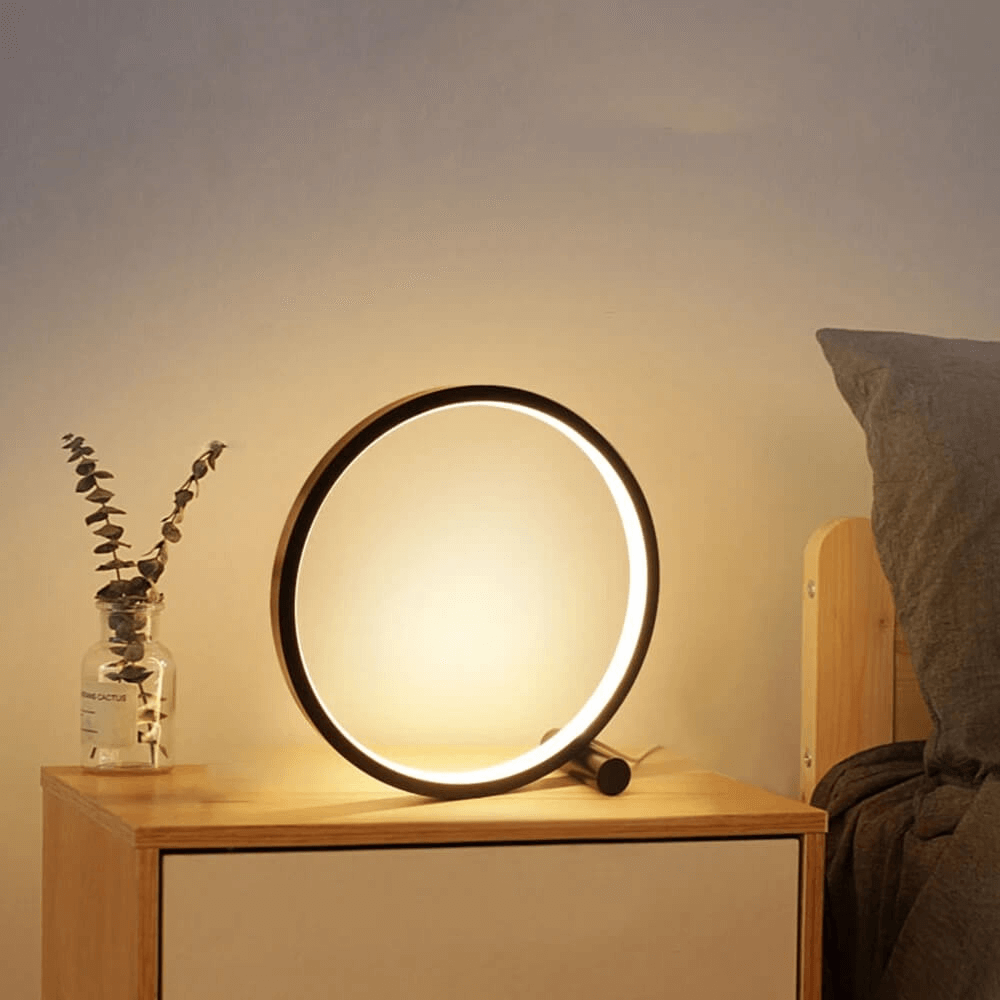Stylish modern table lamp, dimmable for ambient home decor, ideal as a bedroom or living room accent.