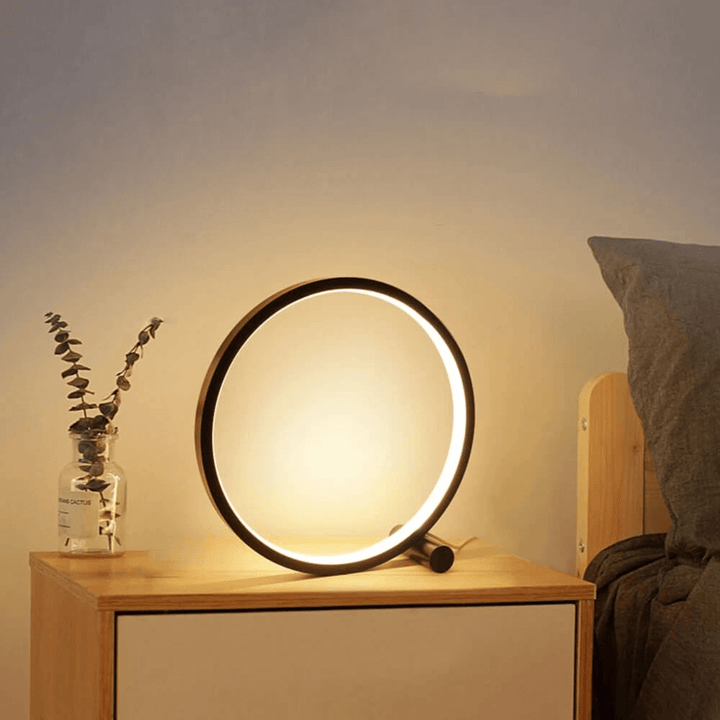 Stylish modern table lamp, dimmable for ambient home decor, ideal as a bedroom or living room accent.