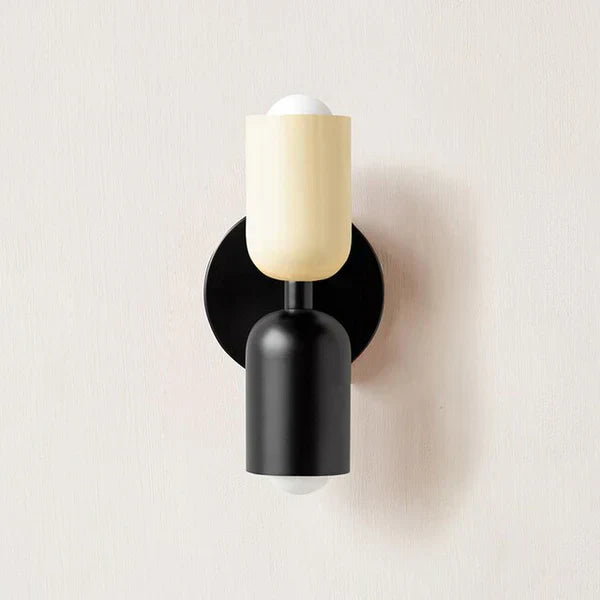 Black dual LED wall sconce, adjustable angles, for focused or ambient light.