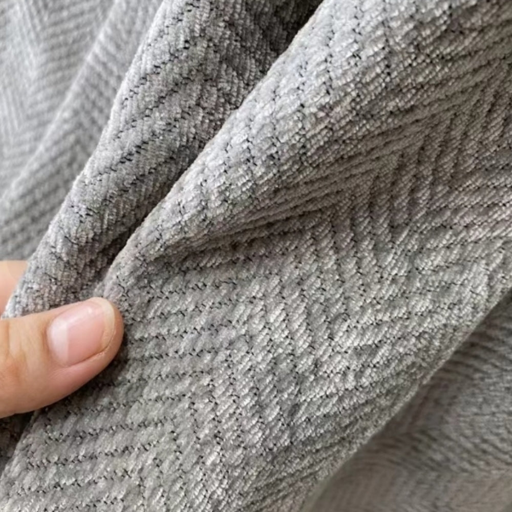 Grey modern sofa throw blanket, pet-friendly & easy-care, perfect for minimalist living room decor.