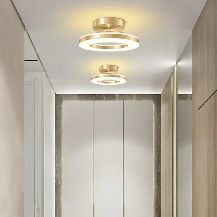 "Modern LED ceiling light with adjustable colors, sleek design, gold and black finish, perfect for contemporary interiors."