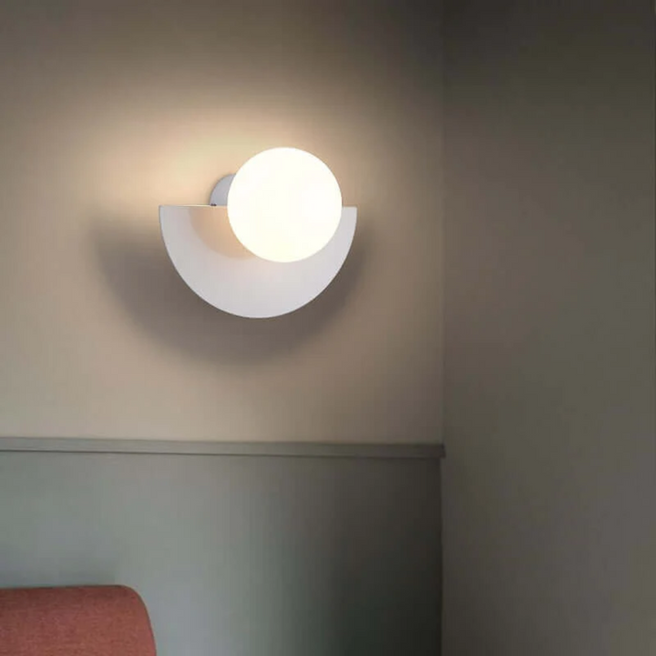 Modern metal half moon wall lamp with integrated LED. Stylish home decor & accent lighting.