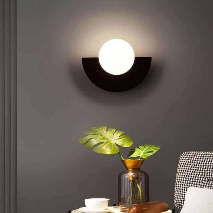 Stylish half moon wall lamp in metal. Perfect modern LED accent light for living room or bedroom decor.
