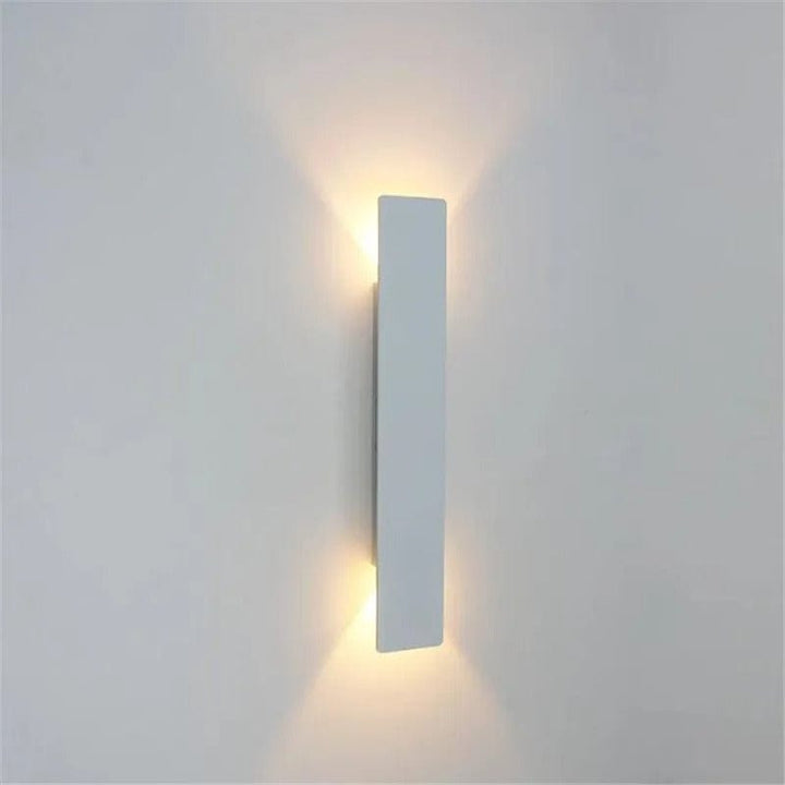 Modern outdoor LED wall light, black or white finish, IP65 waterproof, up/down lighting, enhances exterior decor.