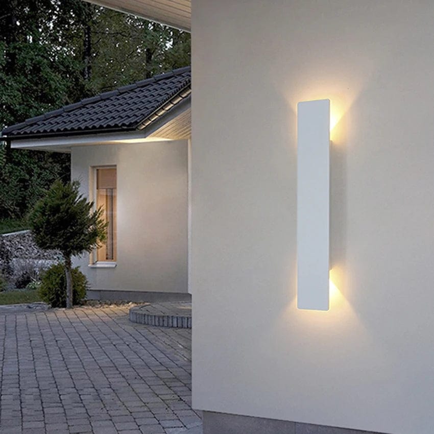 Modern outdoor LED wall light, black or white finish, IP65 waterproof, up/down lighting, enhances exterior decor.