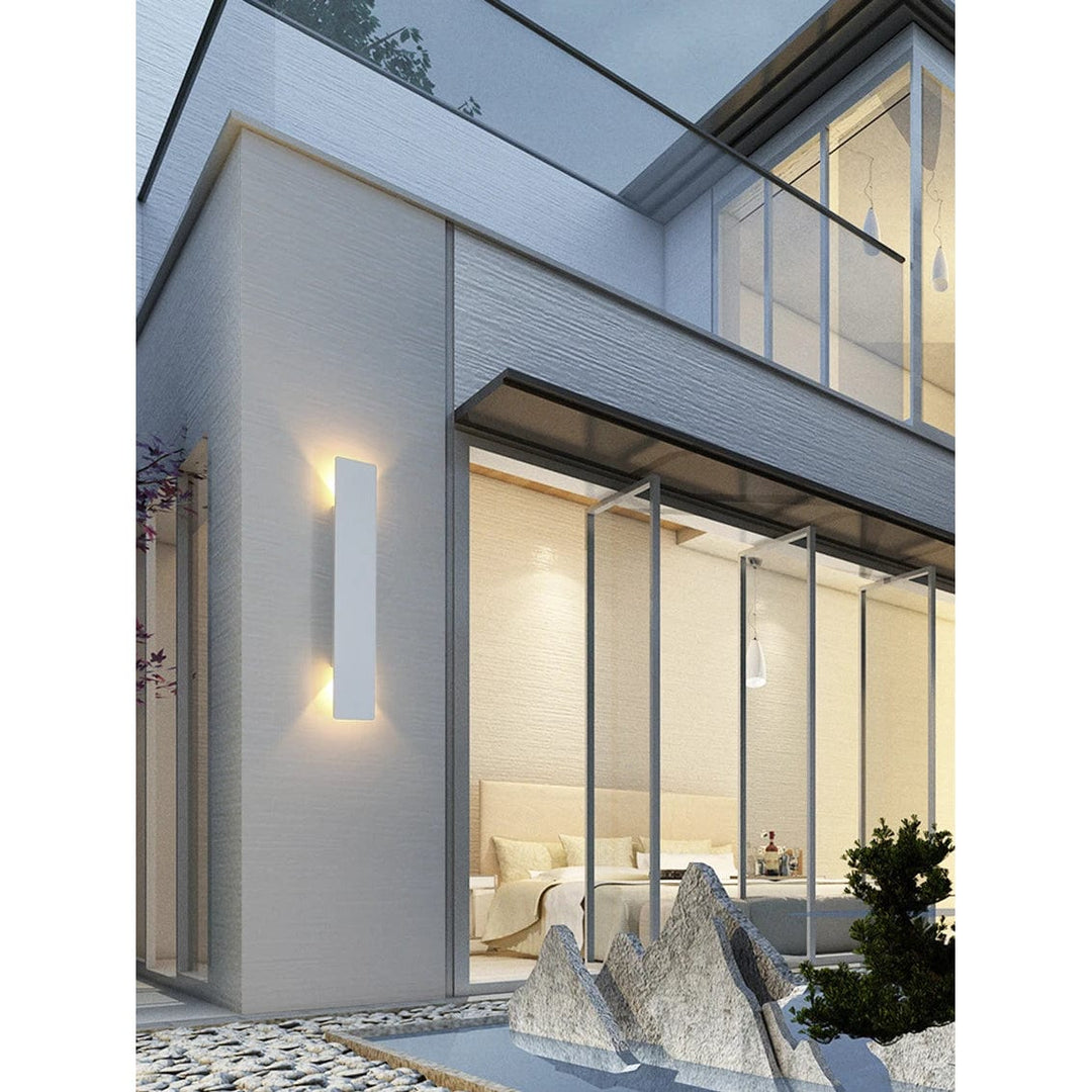 Modern outdoor LED wall light, black or white finish, IP65 waterproof, up/down lighting, enhances exterior decor.