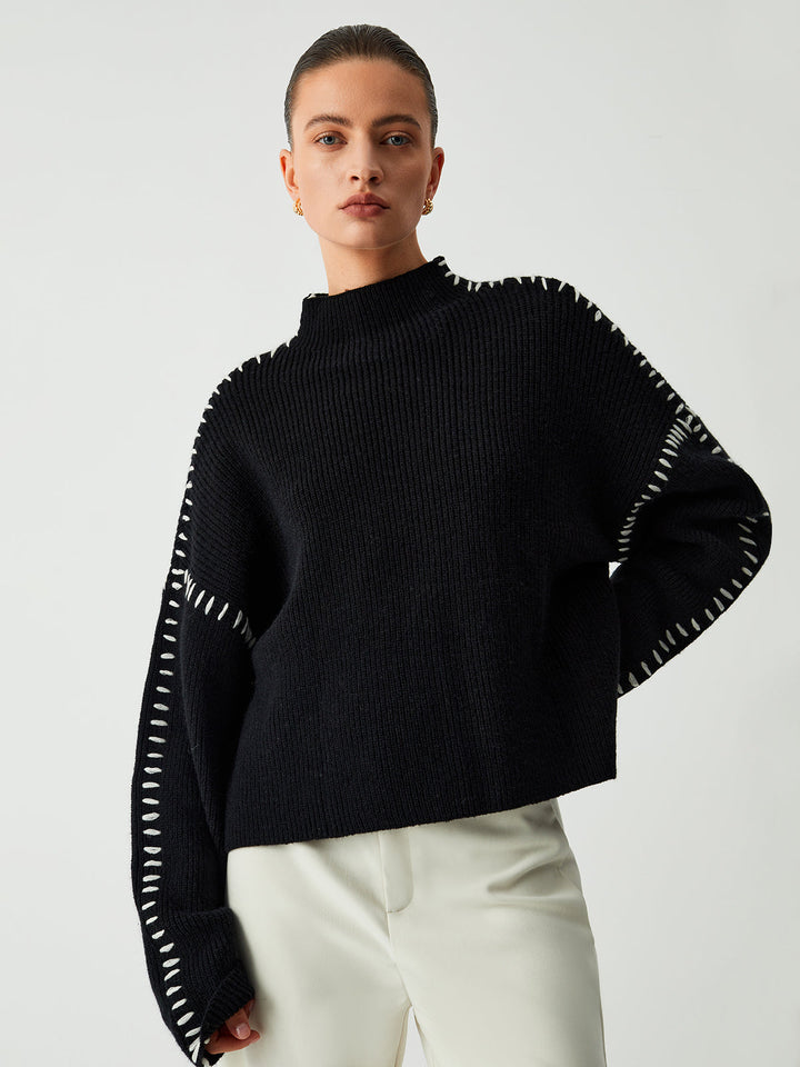 Cozy knitwear oversized mock neck sweater, ideal for women's winter wear & layering.