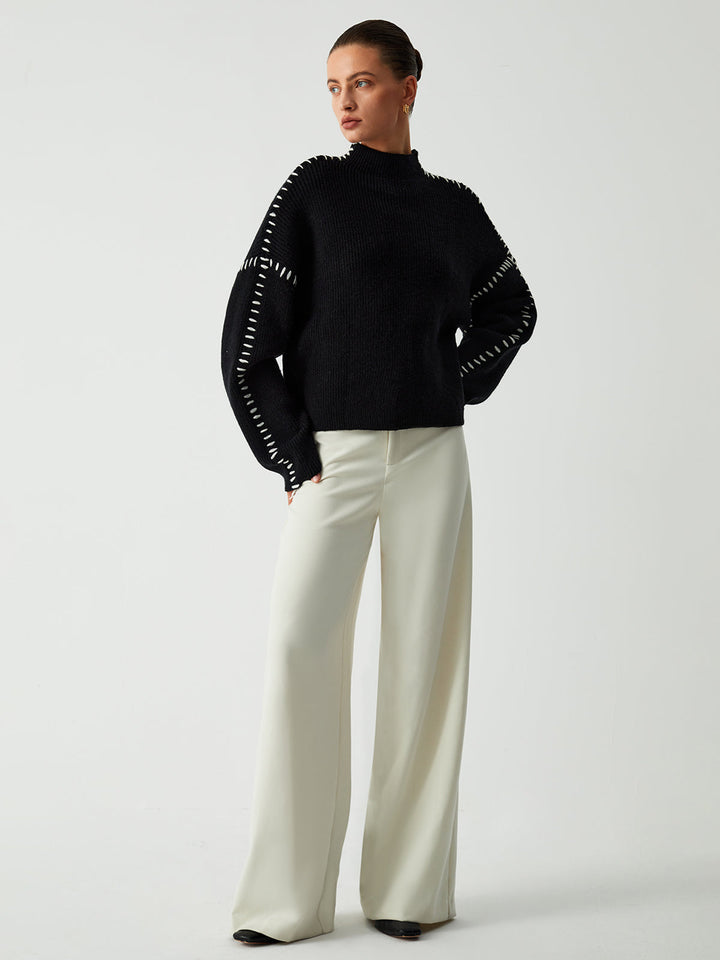 Chic knit oversized mock neck sweater, essential for women's cold-weather fashion & versatile styling.