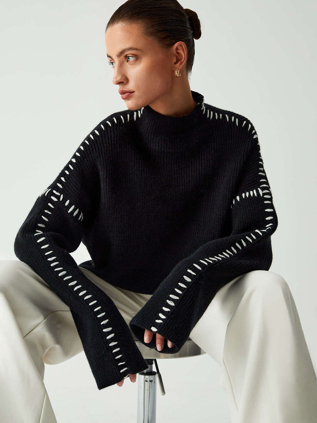 Warm oversized mock neck sweater, a cozy knit essential for women's winter fashion and casual outings.