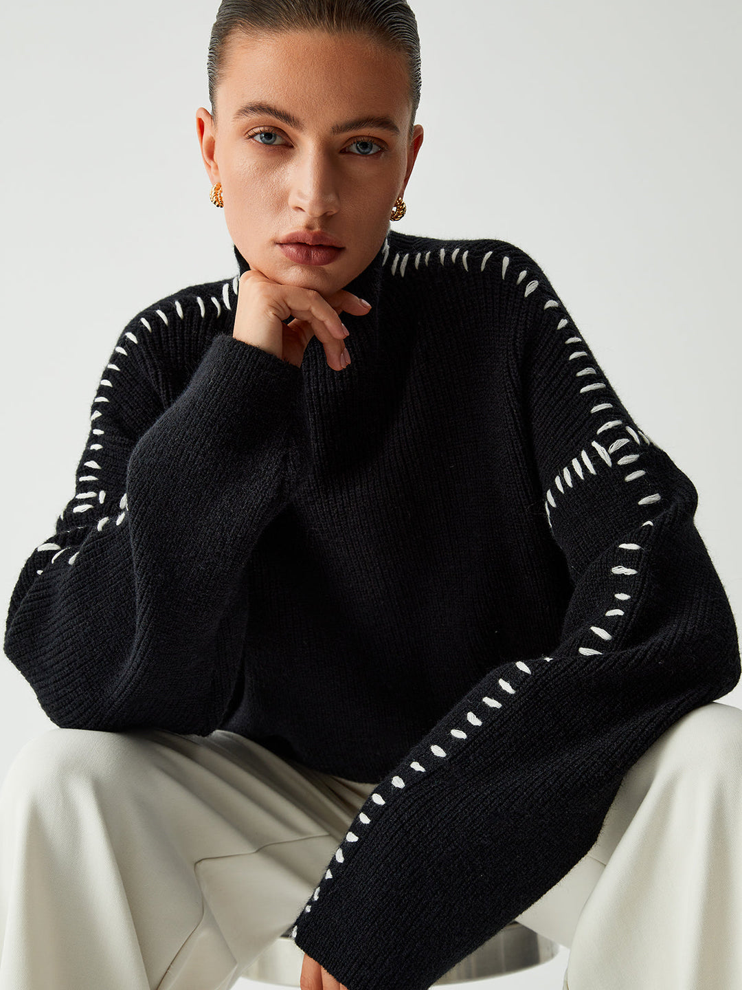 Versatile modern oversized mock neck sweater, perfect for women's casual chic looks and winter layering.