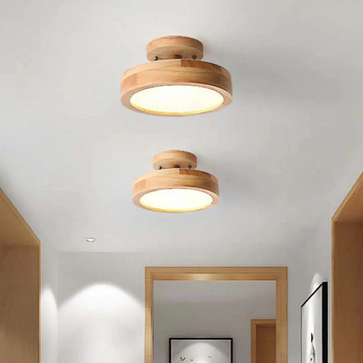 Easy-install modern round LED ceiling light fixture, adjustable ambiance for cozy home lighting.