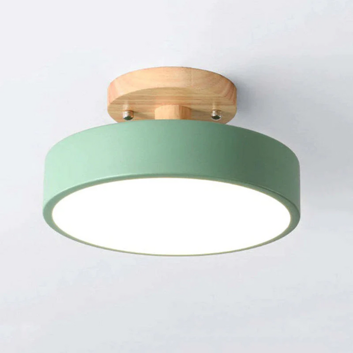 Modern round LED ceiling light, sleek design ideal for contemporary living room or bedroom decor.