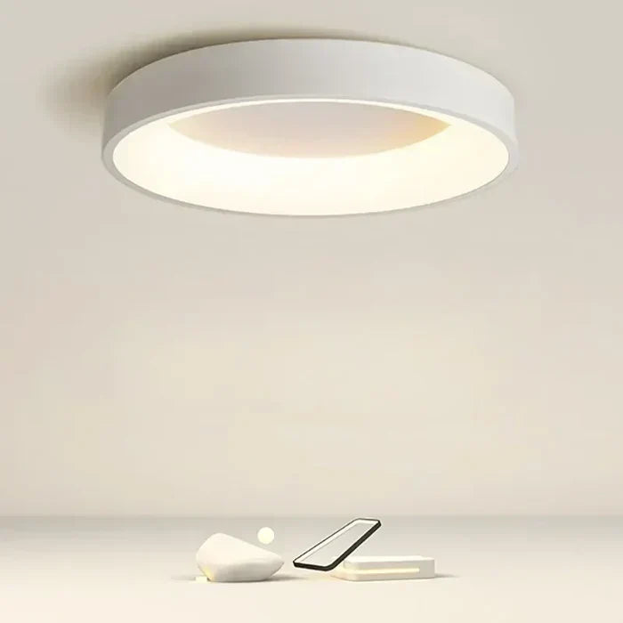 Modern round LED ceiling light for Scandinavian home decor. Minimalist design for contemporary interior spaces.